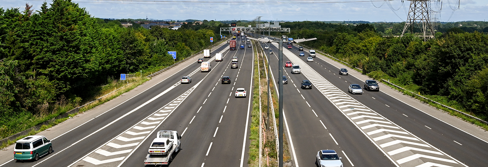 Busy lanes on a UK motorway banner image