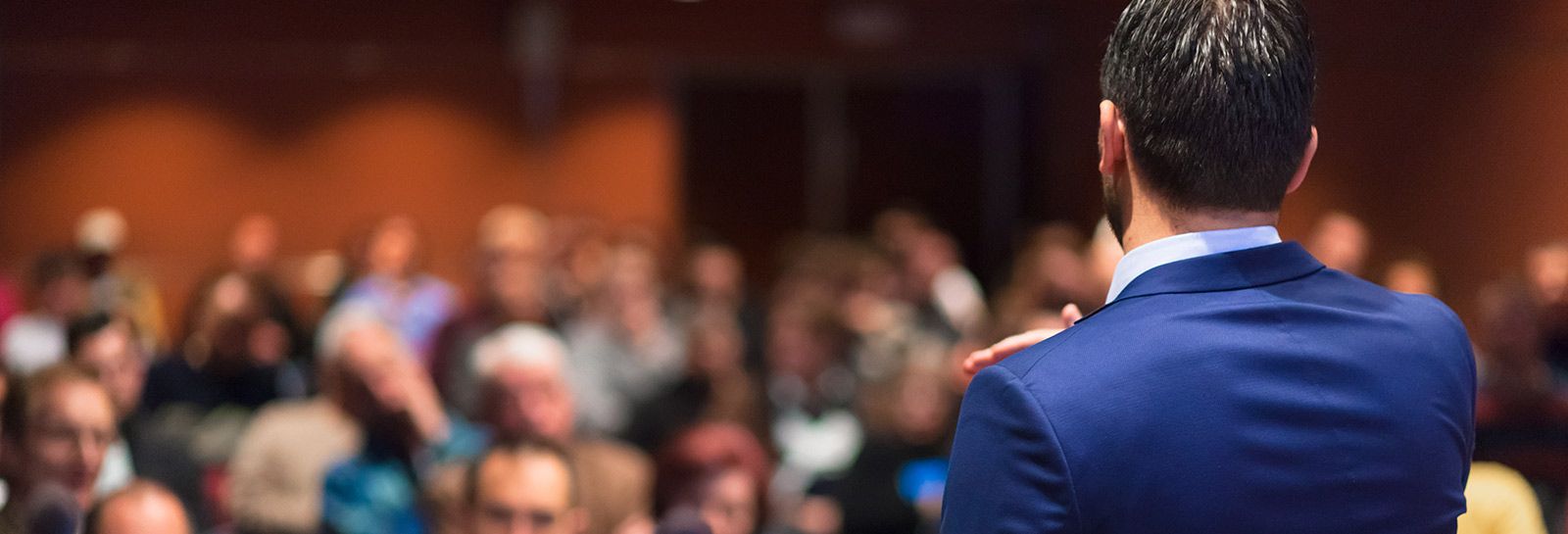 Businessman speaking at conference banner image